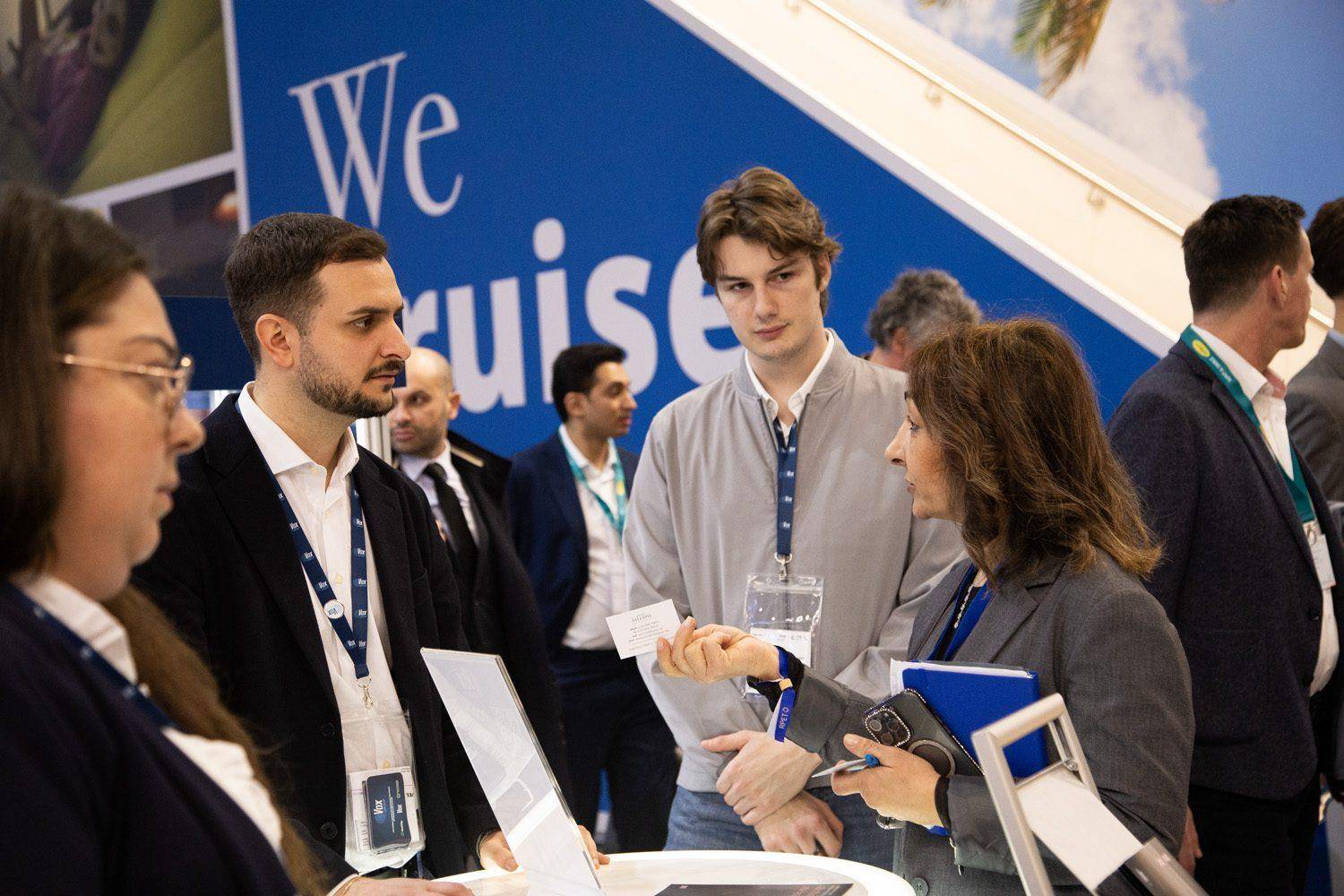 Vox staff talking with visitors at a cruise trade fair stand