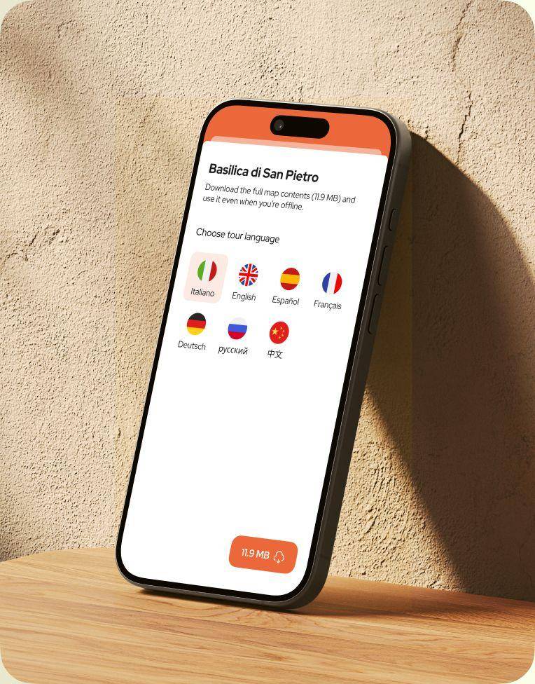 Smartphone leaning on a wall showing the POPGuide language selection