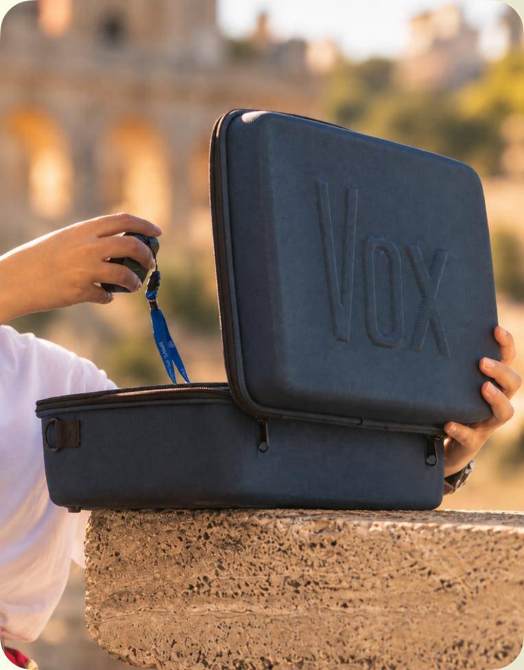 Hands opening the Vox eco-friendly case outdoors